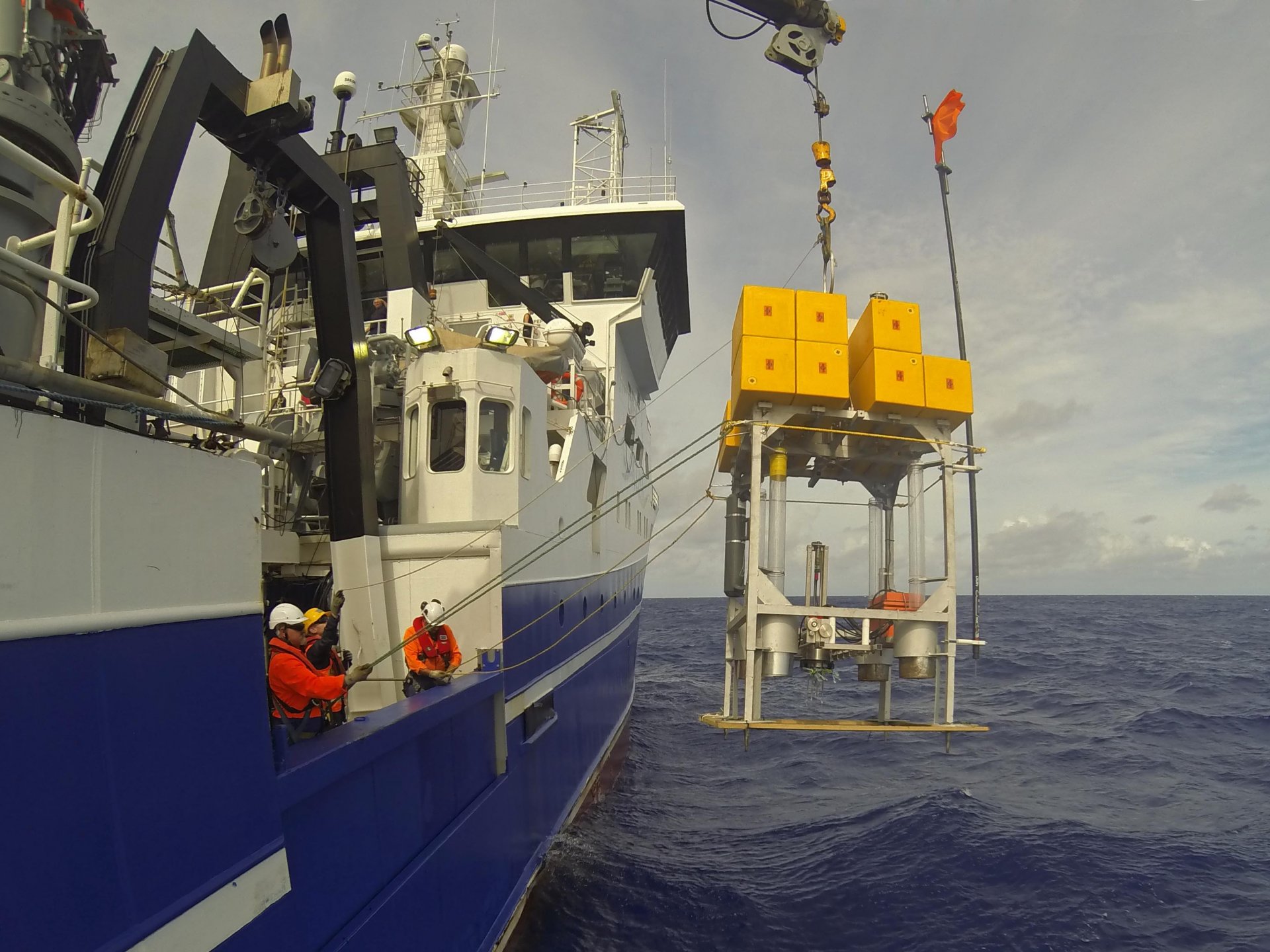 A deep-sea lander being lowered on a previous expedition (Kermadec Trench, December 2017). (Johannes Lemburg)